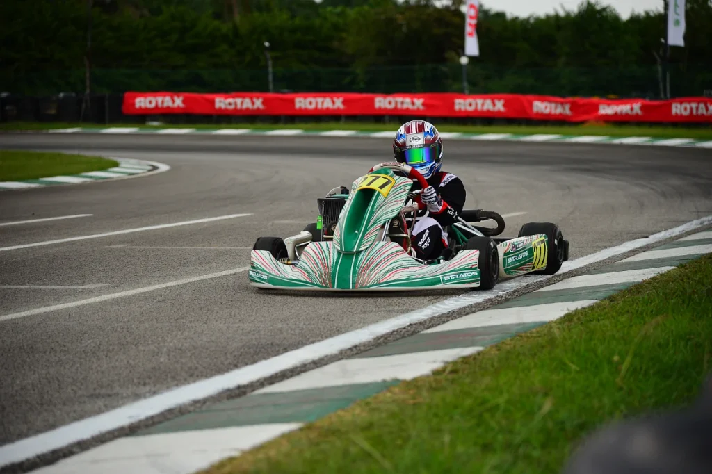 Final Corner of the Sepang Karting Circuit with a Tony Kart/Stratos race kart exiting the final corner.